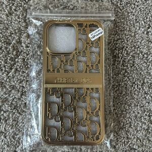Brand new Christian Dior gold 14 Promax phone case.